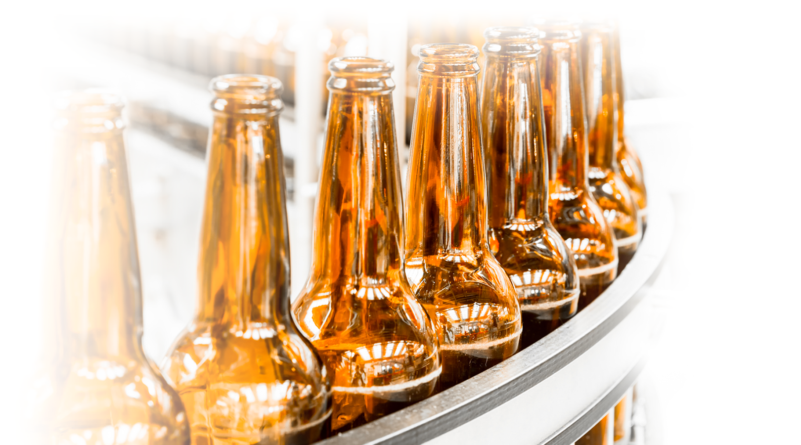 Bottling line with glass beer bottles that have scuff marks