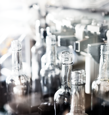 photo of wine bottles on the filling line